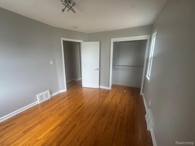248 W Longfellow Ave, Pontiac, MI 48340 - unfurnished bedroom with light wood finished floors and a closet