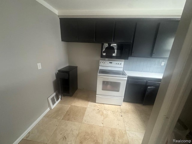 248 W Longfellow Ave, Pontiac, MI 48340 - kitchen with electric range, black microwave, dark cabinetry, light countertops, and backsplash