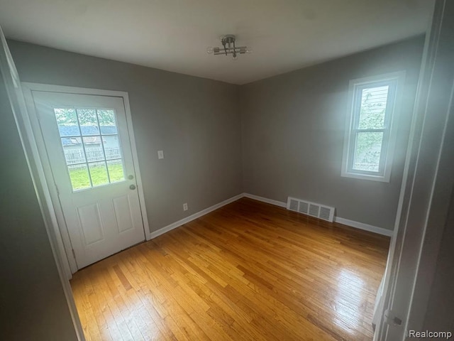 248 W Longfellow Ave, Pontiac, MI 48340 - unfurnished room with healthy amount of natural light and light wood-style floors