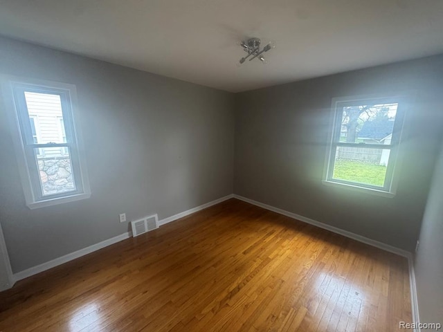 248 W Longfellow Ave, Pontiac, MI 48340 - spare room featuring plenty of natural light and hardwood / wood-style flooring