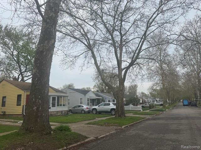 248 W Longfellow Ave, Pontiac, MI 48340 - view of asphalt street with curbs, sidewalks, and a residential view