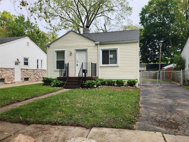 248 W Longfellow Ave, Pontiac, MI 48340 - view of front of property featuring roof with shingles and asphalt driveway