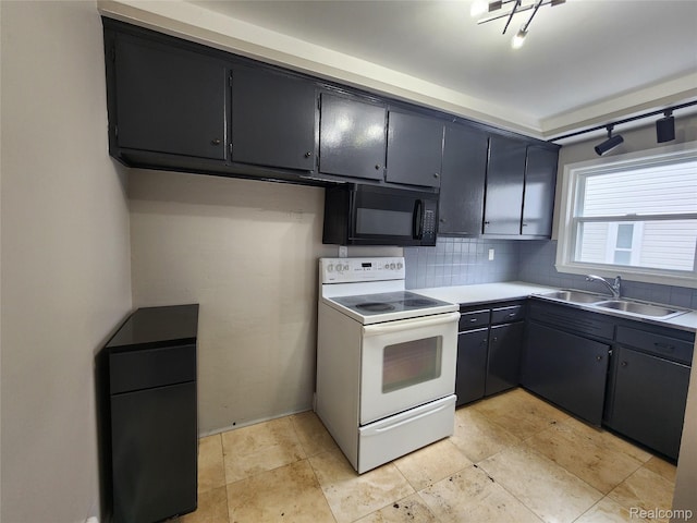 248 W Longfellow Ave, Pontiac, MI 48340 - kitchen with black microwave, electric range, tasteful backsplash, and light countertops