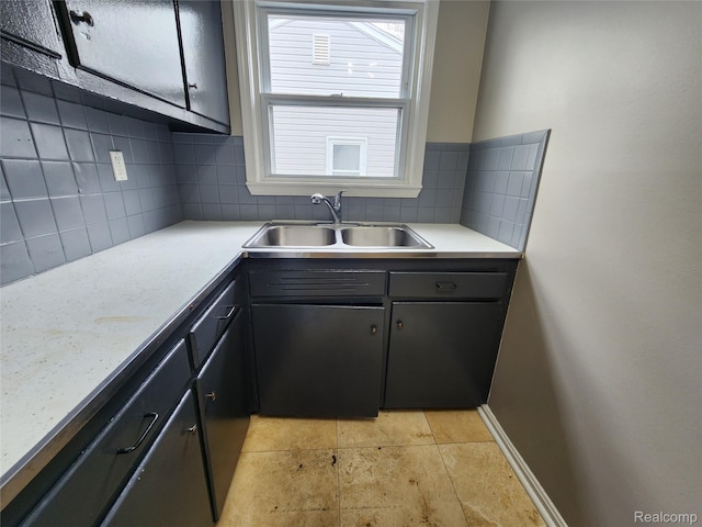 248 W Longfellow Ave, Pontiac, MI 48340 - kitchen featuring decorative backsplash, light countertops, and light stone finish flooring