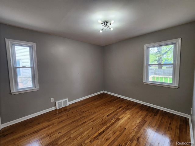 248 W Longfellow Ave, Pontiac, MI 48340 - empty room featuring dark wood finished floors and baseboards