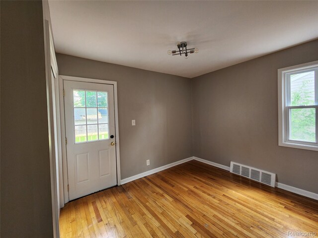248 W Longfellow Ave, Pontiac, MI 48340 - doorway to outside with light wood-style flooring and baseboards