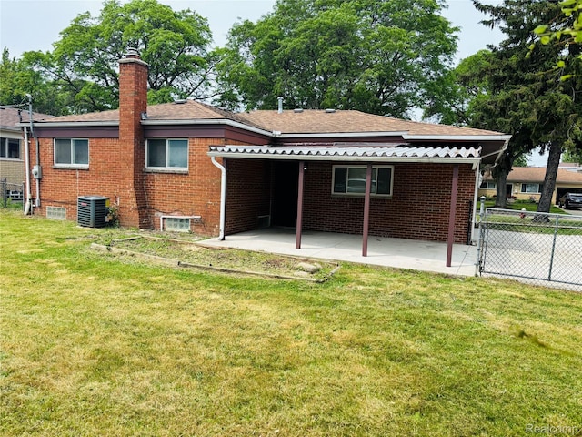 26046 Eureka Dr, Warren, MI 48091 - rear view of house with brick siding, a patio, a chimney, and a shingled roof