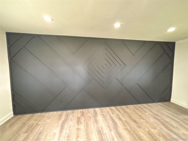 26046 Eureka Dr, Warren, MI 48091 - unfurnished room featuring recessed lighting, a decorative wall, and wood finished floors