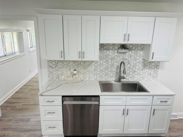 26046 Eureka Dr, Warren, MI 48091 - kitchen featuring dishwasher, white cabinetry, decorative backsplash, light stone counters, and wood finished floors