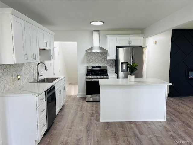26046 Eureka Dr, Warren, MI 48091 - kitchen with wall chimney exhaust hood, appliances with stainless steel finishes, backsplash, light wood-style flooring, and light countertops