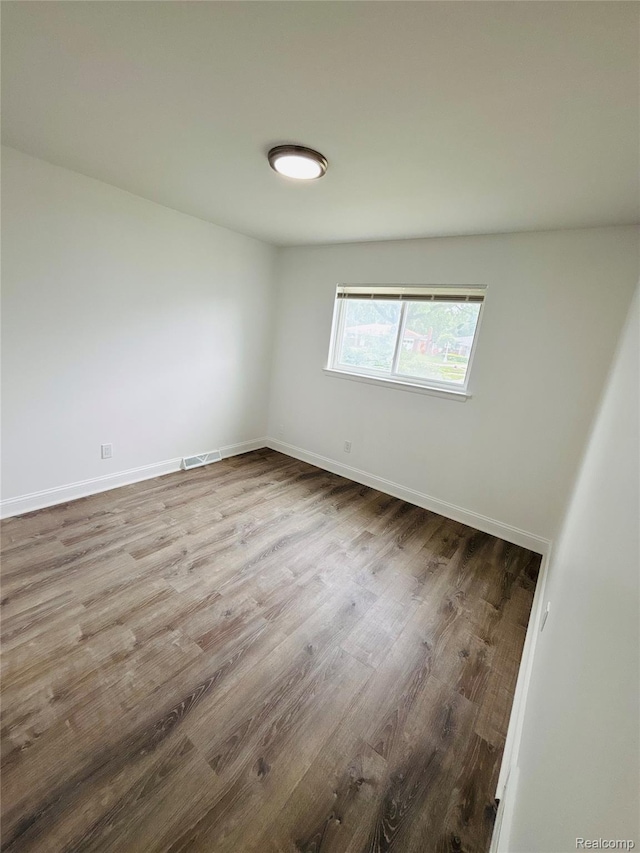 26046 Eureka Dr, Warren, MI 48091 - spare room featuring wood finished floors and baseboards
