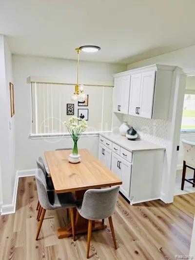26046 Eureka Dr, Warren, MI 48091 - dining space featuring light wood-type flooring