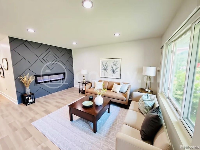 26046 Eureka Dr, Warren, MI 48091 - living area featuring healthy amount of natural light, recessed lighting, wood finished floors, and an accent wall