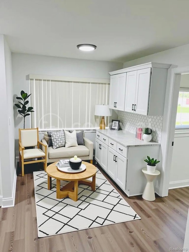 26046 Eureka Dr, Warren, MI 48091 - living room featuring light wood-style flooring and baseboards