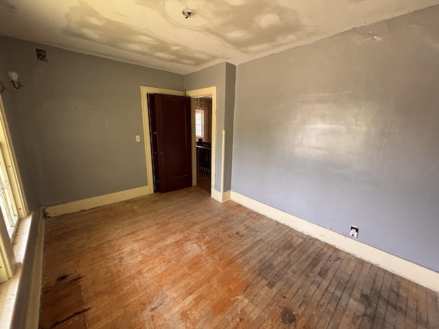 1407 Michigan Ave, Alma, MI 48801 - spare room featuring light wood-style flooring and baseboards