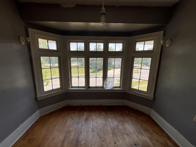 1407 Michigan Ave, Alma, MI 48801 - unfurnished dining area featuring baseboards and dark wood finished floors