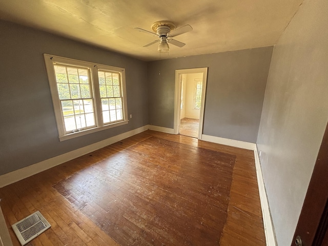 1407 Michigan Ave, Alma, MI 48801 - empty room featuring a ceiling fan and wood-type flooring