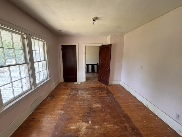 1407 Michigan Ave, Alma, MI 48801 - unfurnished room featuring wood-type flooring and baseboards