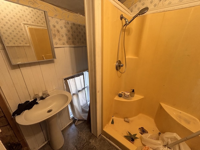 1407 Michigan Ave, Alma, MI 48801 - full bathroom featuring a shower, a wainscoted wall, and wallpapered walls