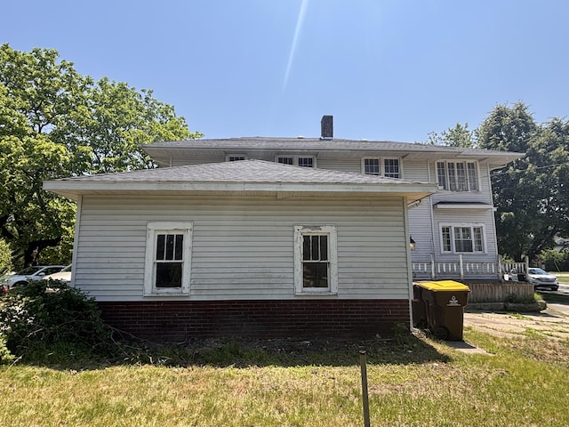 1407 Michigan Ave, Alma, MI 48801 - back of house with a yard and a chimney