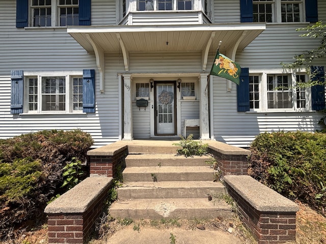 1407 Michigan Ave, Alma, MI 48801 - doorway to property featuring covered porch