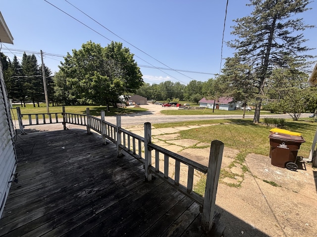 1407 Michigan Ave, Alma, MI 48801 - wooden deck featuring a lawn