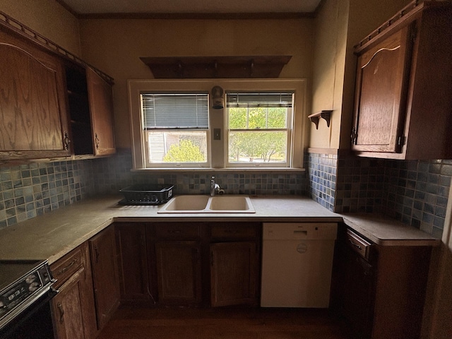 1407 Michigan Ave, Alma, MI 48801 - kitchen with white dishwasher, stove, light countertops, and tasteful backsplash