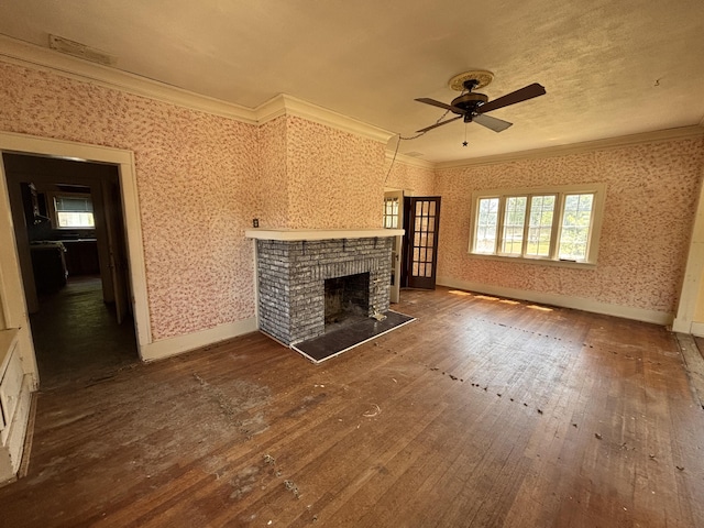 1407 Michigan Ave, Alma, MI 48801 - unfurnished living room featuring ornamental molding, hardwood / wood-style flooring, ceiling fan, and a fireplace