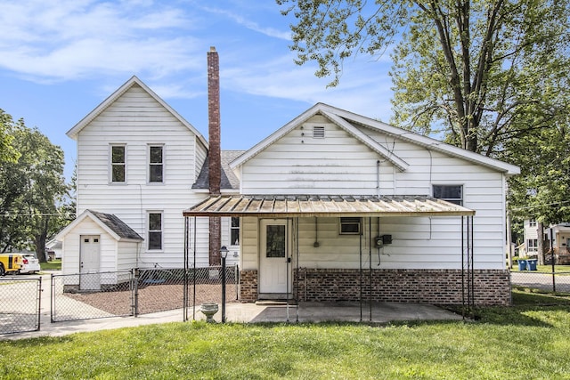 140 W Corey St, Bronson, MI 49028 - view of front facade featuring a gate, brick siding, a metal roof, and a standing seam roof