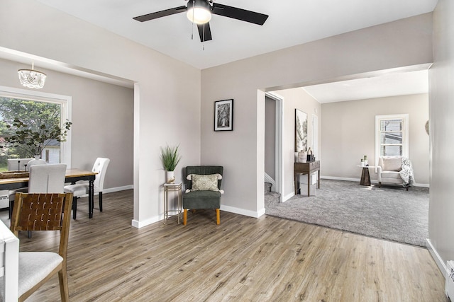 140 W Corey St, Bronson, MI 49028 - sitting room featuring light wood-style floors, a ceiling fan, and a chandelier