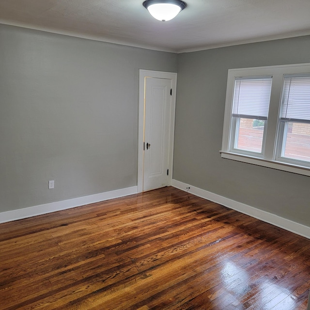 2356 SE Paris, Grand Rapids, MI 49507 - empty room with dark wood-style floors and baseboards