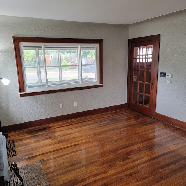 2356 SE Paris, Grand Rapids, MI 49507 - entryway with dark wood-type flooring and a textured wall