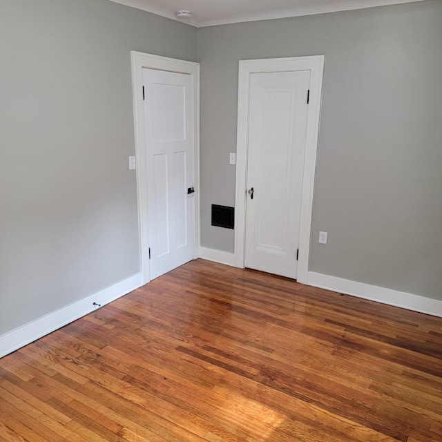 2356 SE Paris, Grand Rapids, MI 49507 - spare room featuring wood finished floors and a smoke detector