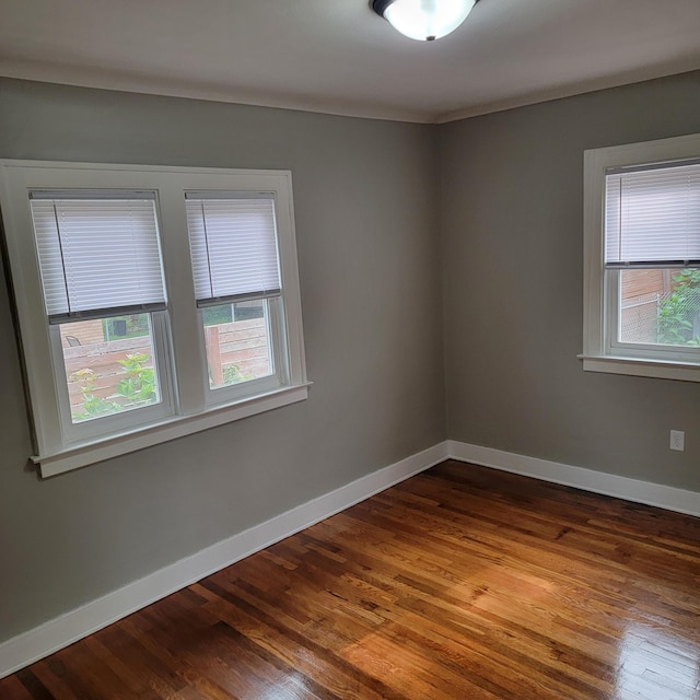 2356 SE Paris, Grand Rapids, MI 49507 - unfurnished room featuring dark wood finished floors and baseboards
