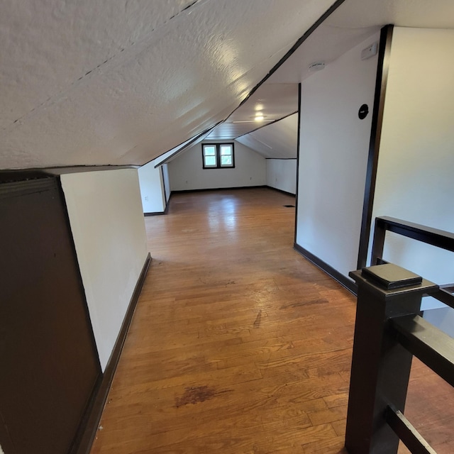 2356 SE Paris, Grand Rapids, MI 49507 - bonus room featuring lofted ceiling, wood finished floors, and a textured ceiling
