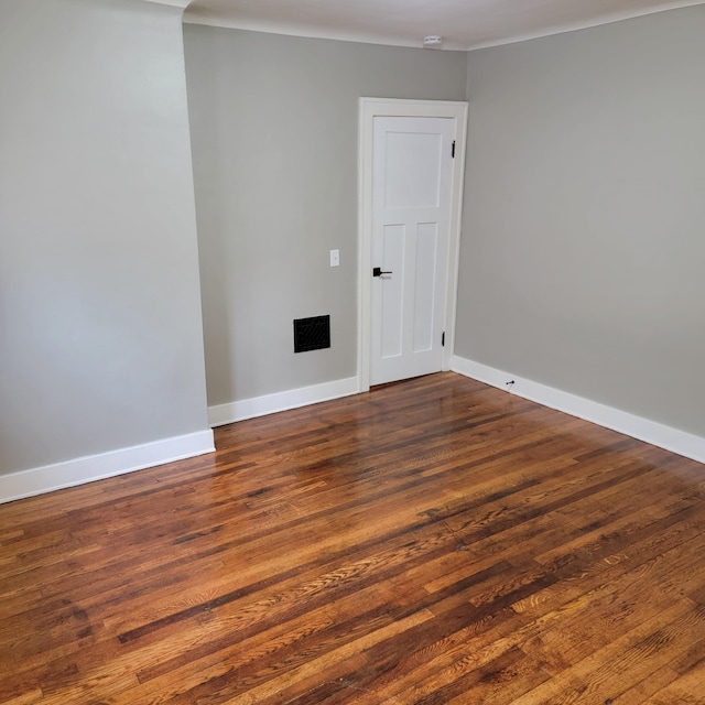 2356 SE Paris, Grand Rapids, MI 49507 - empty room featuring crown molding and wood finished floors