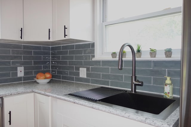 2356 SE Paris, Grand Rapids, MI 49507 - kitchen view of white cabinets and backsplash