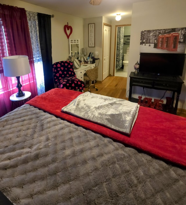 24825 Timber Ridge Trl, Flat Rock, MI 48134 - bedroom with wood finished floors and ensuite bathroom