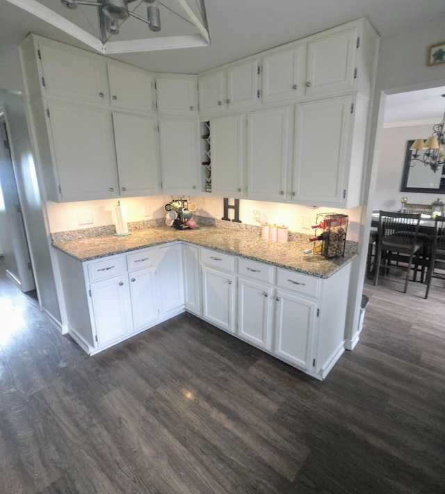 24825 Timber Ridge Trl, Flat Rock, MI 48134 - kitchen with dark wood-type flooring, white cabinetry, and light stone counters