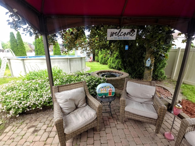 24825 Timber Ridge Trl, Flat Rock, MI 48134 - view of patio / terrace featuring an outdoor pool and a gazebo