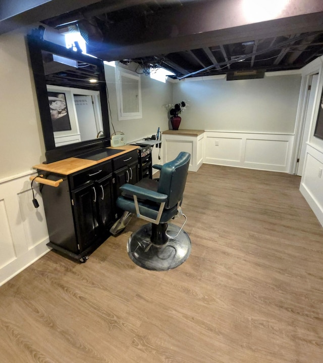 24825 Timber Ridge Trl, Flat Rock, MI 48134 - finished below grade area with a decorative wall, wood finished floors, and a wainscoted wall