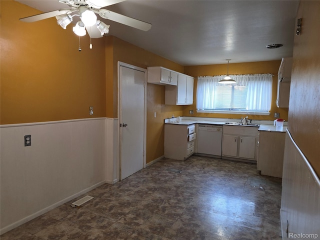 21450 Evergreen Rd, Southfield, MI 48075 - kitchen with white dishwasher, ceiling fan, light countertops, and decorative light fixtures