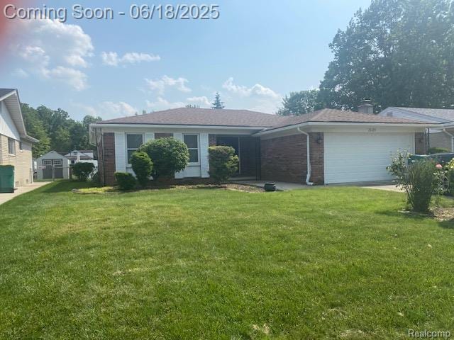 20329 Churchill Ave, Trenton, MI 48183 - view of front of home with an attached garage, a front yard, and brick siding