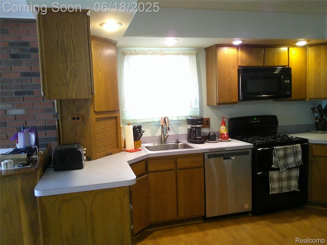 20329 Churchill Ave, Trenton, MI 48183 - kitchen featuring black microwave, dishwasher, gas range, and light countertops