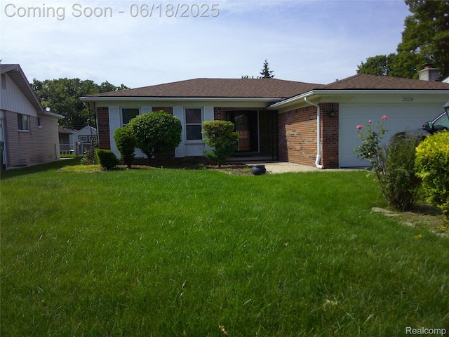 20329 Churchill Ave, Trenton, MI 48183 - view of front facade featuring brick siding, a garage, a front lawn, and a chimney