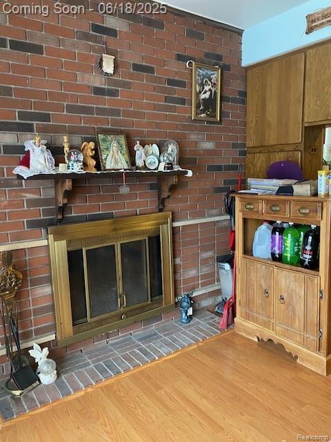 20329 Churchill Ave, Trenton, MI 48183 - detailed view of wood finished floors and a fireplace
