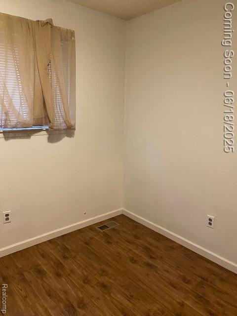 20329 Churchill Ave, Trenton, MI 48183 - empty room featuring dark wood-style floors