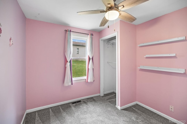2263 Overridge Ave, Waterford, MI 48327 - unfurnished bedroom with carpet floors, a closet, and a ceiling fan