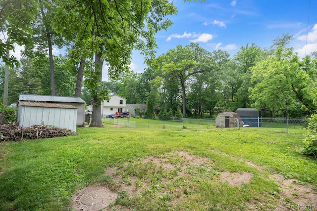 2263 Overridge Ave, Waterford, MI 48327 - fenced backyard with a shed and view of wooded area