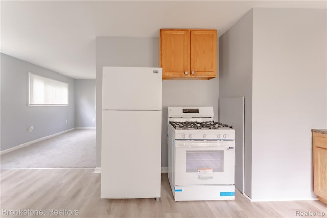 853 Melrose St, Pontiac, MI 48340 - kitchen with white appliances, light wood-type flooring, and light brown cabinets